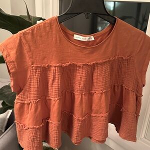 Altar’d State Cropped Tiered Shortsleeve Top in a Terra Cotta Color